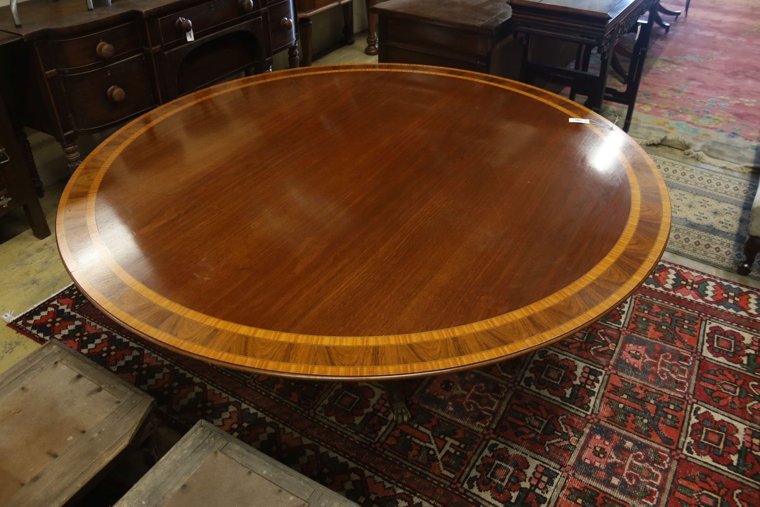 A William Tillman style satinwood banded circular mahogany breakfast table, diameter 184cm, height 75cm